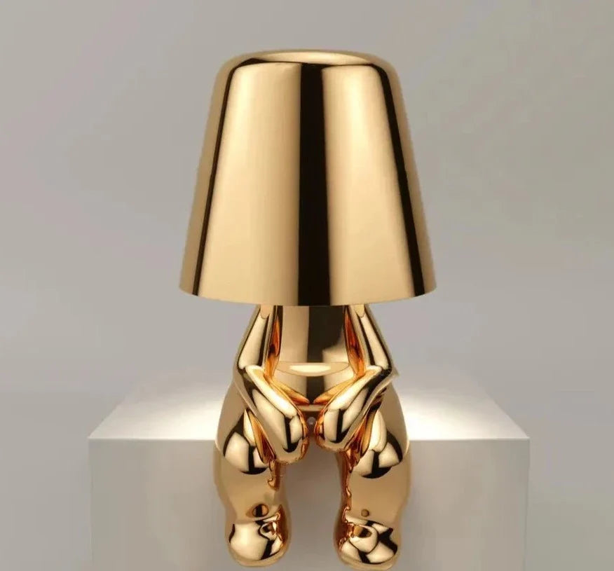 Cordless Thinker sculpture table lamp with frosted glass shade for modern decor