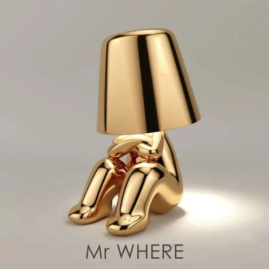 Cordless Thinker sculpture table lamp with frosted glass shade for modern decor