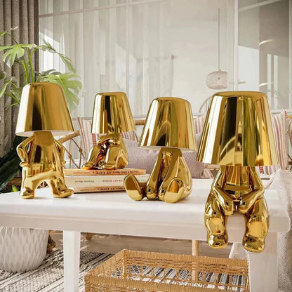 Cordless Thinker sculpture table lamp with frosted glass shade for modern decor