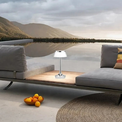 Cordless touch-controlled table lamp with warm glow on a nightstand in an apartment
