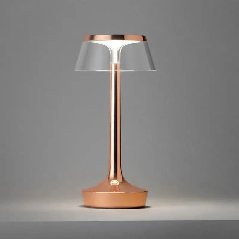 Cordless touch-controlled table lamp with warm glow on a nightstand in an apartment