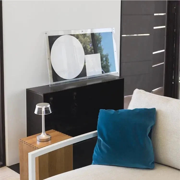Cordless touch-controlled table lamp with warm glow on a nightstand in an apartment