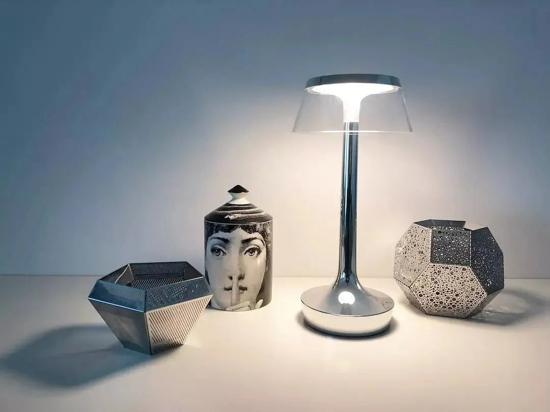 Cordless touch-controlled table lamp with warm glow on a nightstand in an apartment
