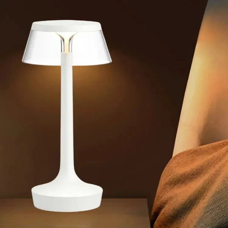 Cordless touch-controlled table lamp with warm glow on a nightstand in an apartment