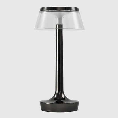 Cordless touch-controlled table lamp with warm glow on a nightstand in an apartment