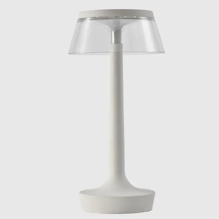 Cordless touch-controlled table lamp with warm glow on a nightstand in an apartment