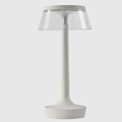Cordless touch-controlled table lamp with warm glow on a nightstand in an apartment