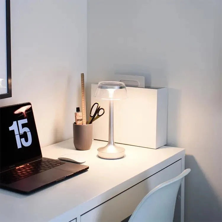 Cordless touch-controlled table lamp with warm glow on a nightstand in an apartment