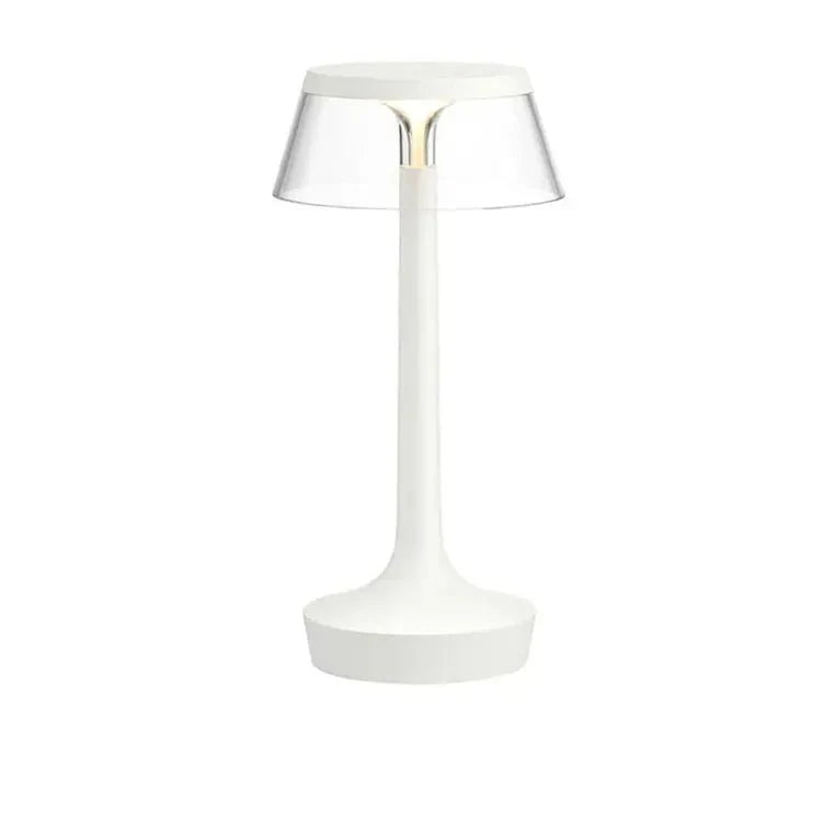 Cordless touch-controlled table lamp with warm glow on a nightstand in an apartment