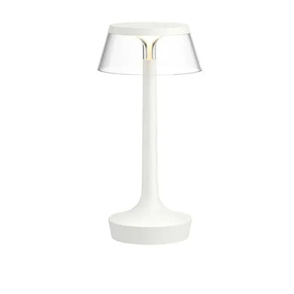 Cordless touch-controlled table lamp with warm glow on a nightstand in an apartment