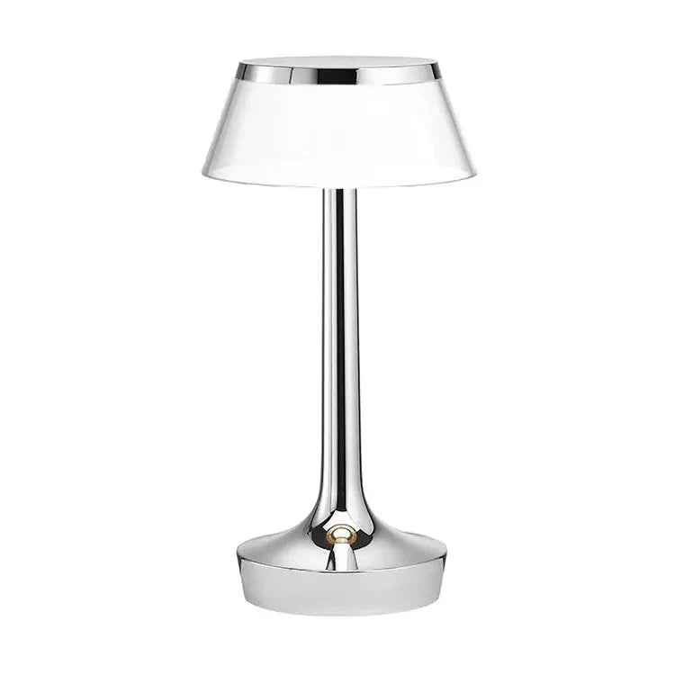 Cordless touch-controlled table lamp with warm glow on a nightstand in an apartment