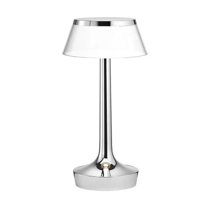 Cordless touch-controlled table lamp with warm glow on a nightstand in an apartment