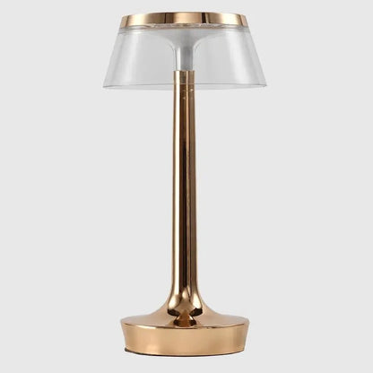 Cordless touch-controlled table lamp with warm glow on a nightstand in an apartment