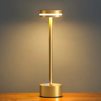 Portable cordless table lamp with aluminum body and round shade for camping and outdoor use