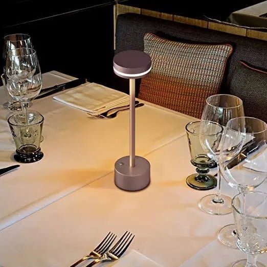 Portable cordless table lamp with aluminum body and round shade for camping and outdoor use