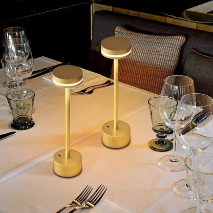 Portable cordless table lamp with aluminum body and round shade for camping and outdoor use